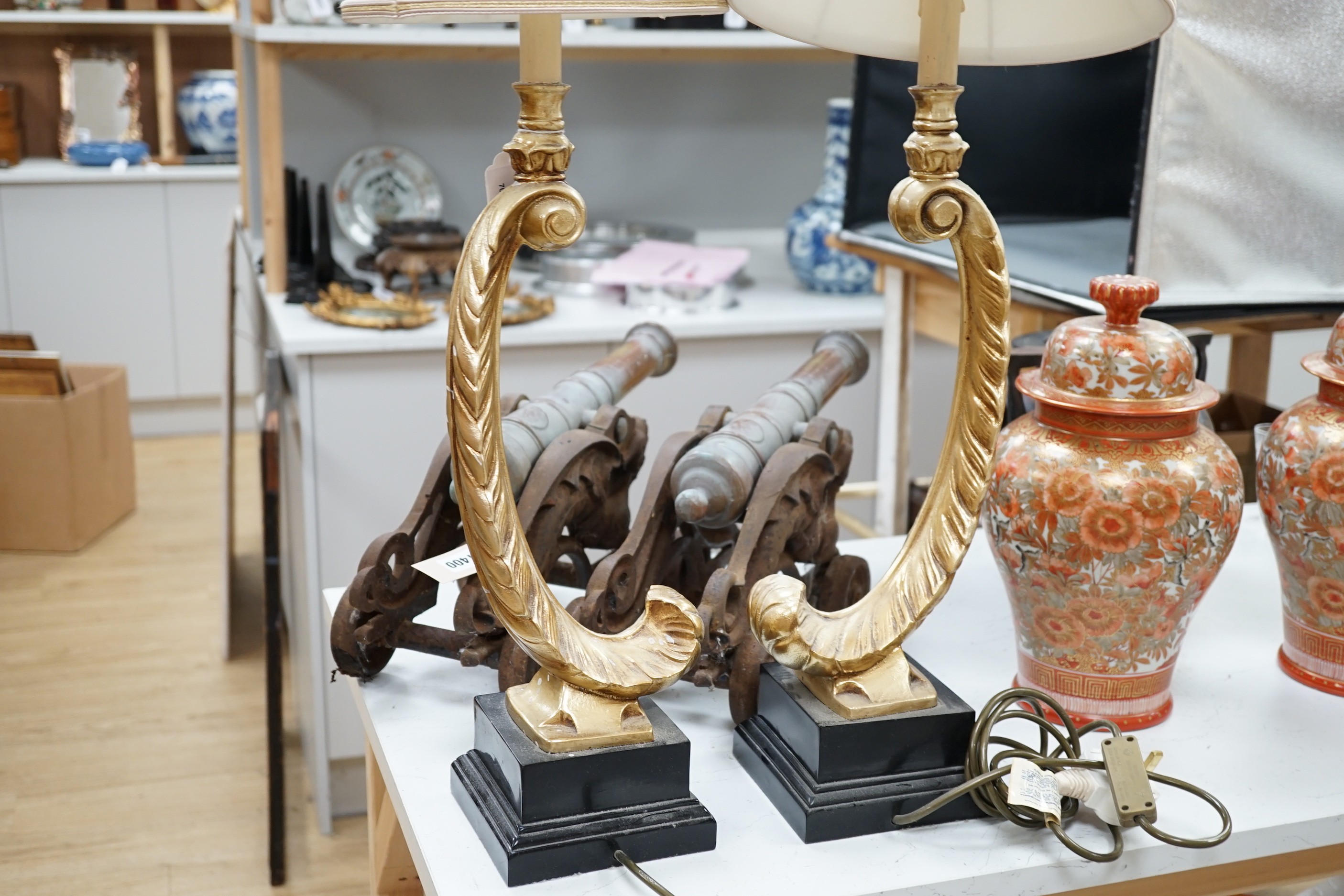 A pair of gilt resin feather table lamps. 72cm high